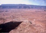 Hole-in-the-Rock crevice with the Kaiparowits Plateau in the background, Lamont Crabtree Photo